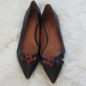 Coach flower flats.